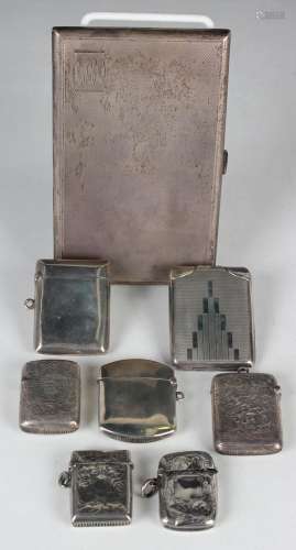 A George VI silver rectangular engine turned cigarette case,...