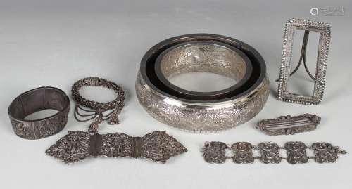 A collection of Indian and Eastern white metal items, includ...