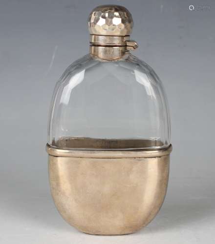 A late Victorian silver mounted faceted cut glass hip flask,...