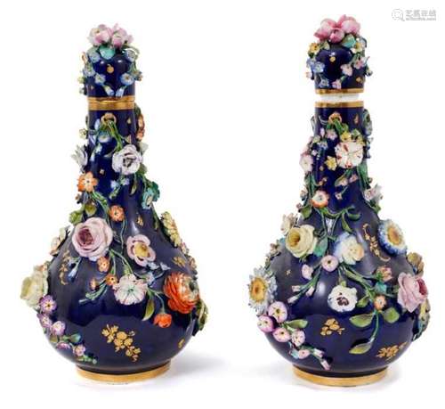 Pair of 19th century floral encrusted vases and covers