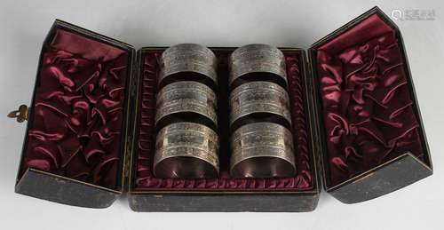 A set of six late Victorian silver napkin rings with engrave...