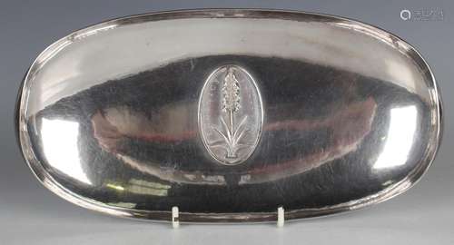 A Modernist silver dish of planished oval form, the centre w...