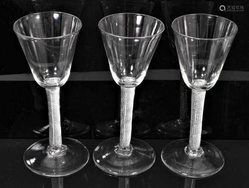 Three large wine glasses, each with air twist stem, circa 17...