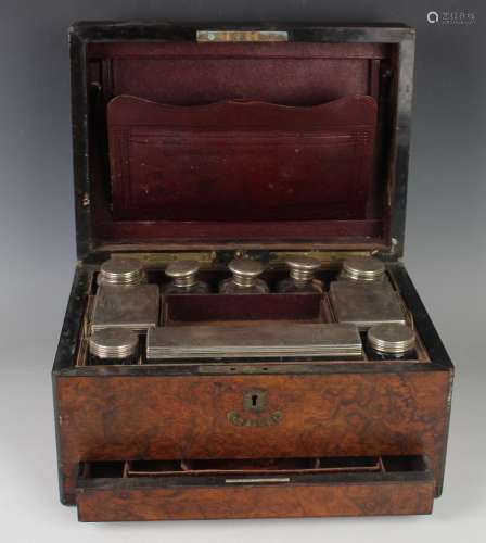 A Victorian burr walnut vanity case, the interior containing...