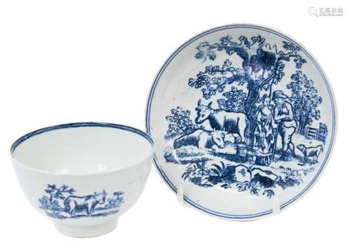 A Liverpool tea bowl and saucer, printed in blue with a milk...