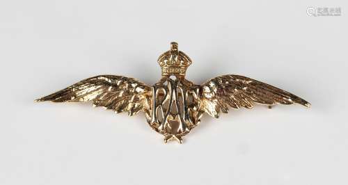 A gold brooch, designed as the winged badge of the Royal Air...