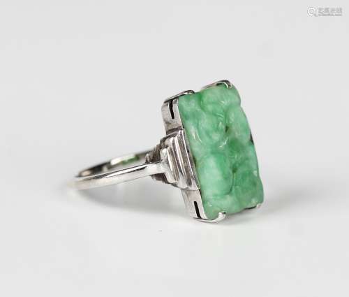 A white gold and jade ring, mounted with a rectangular jade ...