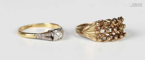 A gold and diamond single stone ring, mounted with a cushion...