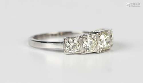 A platinum and diamond five stone ring, mounted with a row o...