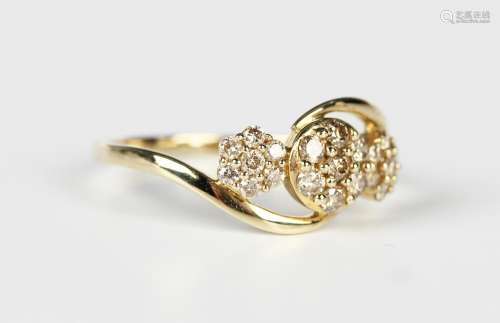 A 9ct gold and champagne diamond ring in a triple cluster tw...