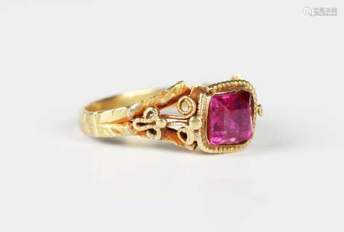 A gold and red gem set solitaire ring, possibly Asian, mount...
