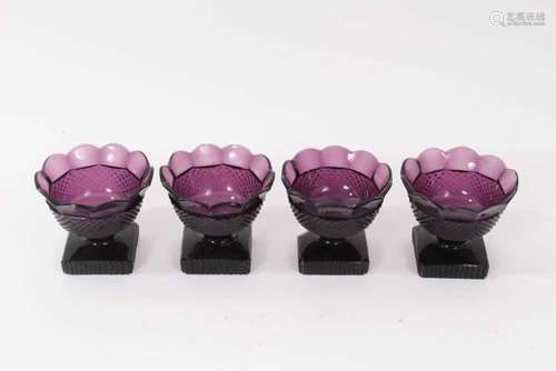 A set of four 19th century amethyst tinted glass salts