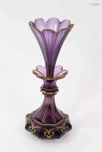 A Victorian amethyst tinted glass scent bottle and stopper