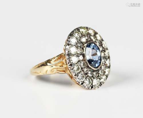 A gold, sapphire and diamond cluster ring, collet set with t...
