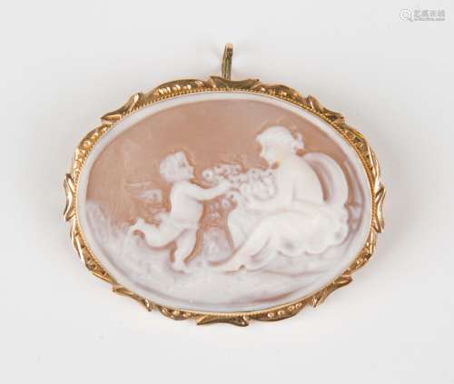 A gold mounted oval shell cameo pendant brooch, carved as a ...