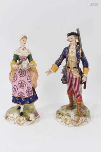 A pair of German porcelain figures of a shepherd and shepher...