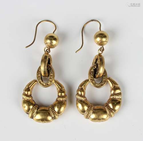 A pair of gold cased circular pendant earrings, each with a ...