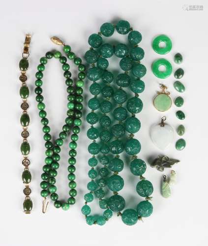 A single row necklace of graduated moulded green glass beads...