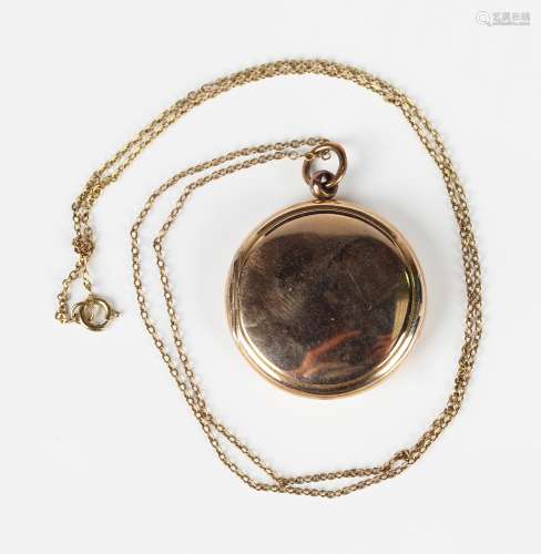 A 9ct gold circular twin sided pendant locket, length 3.9cm,...