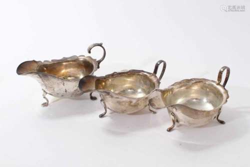 Pair of silver sauce boats by Viners, together with another ...