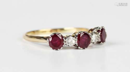 A gold, diamond and ruby five stone ring, claw set with thre...