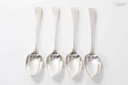 Set of four bright cut silver table spoons by Hester Bateman