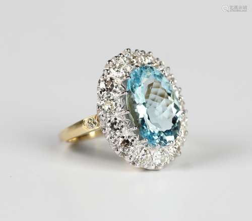 An aquamarine and diamond cluster ring, claw set with the la...