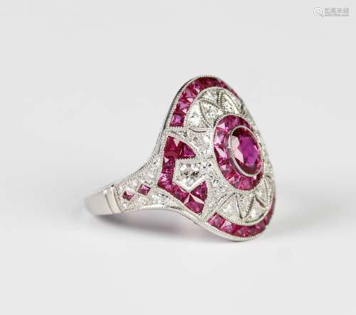 A platinum, ruby and diamond cocktail style ring, collet set...