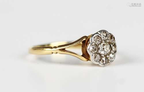 A gold and diamond nine stone cluster ring, mounted with cus...