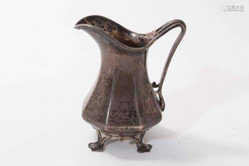 1920 silver cream jug of hexagonal baluster form, with reede...
