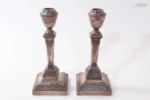 Pair of Edwardian silver candlesticks