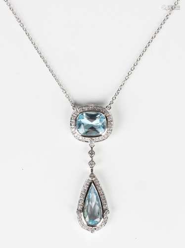 A white gold, blue topaz and diamond pendant necklace, the f...