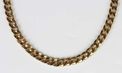 A gold neckchain in a faceted hollow oval link design, on a ...