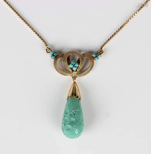 A gold and turquoise pendant necklace, the drop carved in a ...