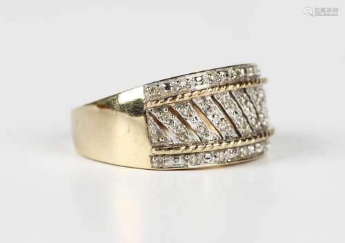 A 9ct gold and diamond ring in a wide band pierced slanting ...