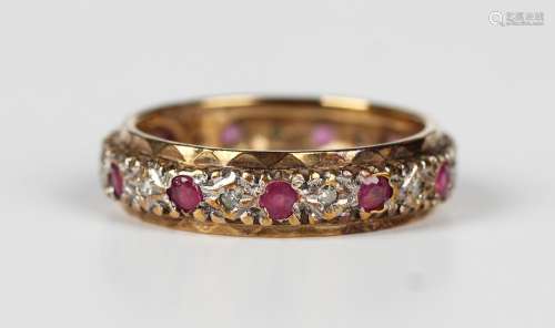 A 9ct gold, ruby and diamond full eternity ring, mounted wit...