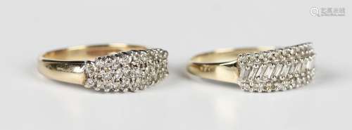 A 9ct gold ring, mounted with a row of baguette diamonds bet...