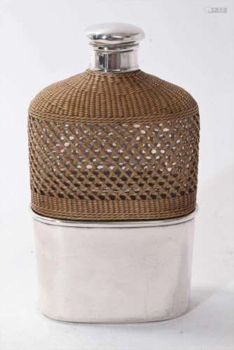 Victorian silver mounted glass hip flask with rattan cover a...