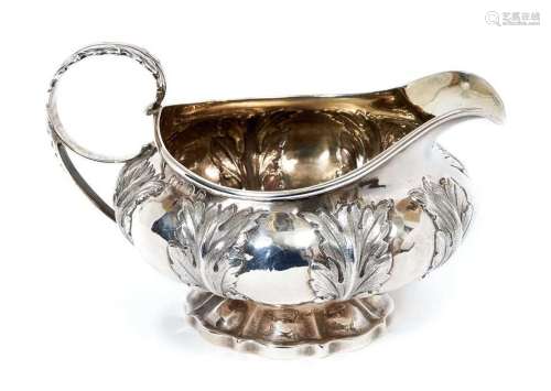 George IV silver cream jug of compressed melon form with cha...