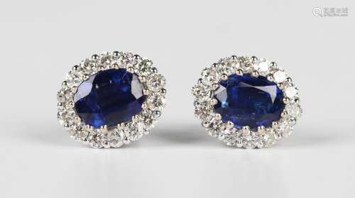 A pair of white gold, kyanite and diamond cluster earstuds, ...