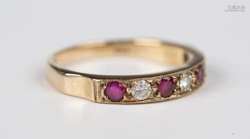 A 9ct gold, ruby and diamond seven stone half-hoop ring, mou...