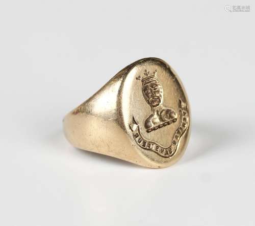 A 9ct gold oval signet ring, crest and motto engraved, Birmi...