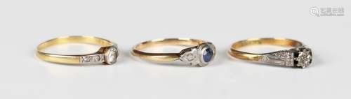 A gold ring, mounted with the principal cushion cut diamond ...