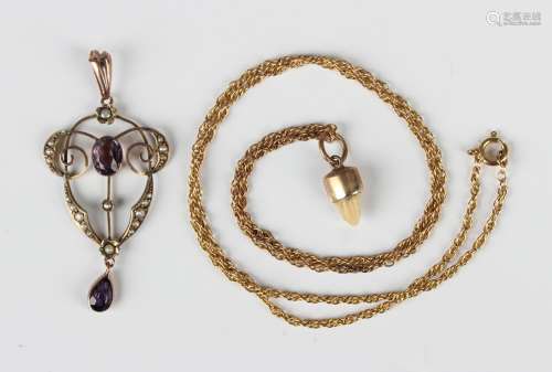 A gold, amethyst and seed pearl pendant, mounted with an ova...
