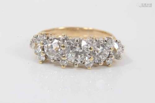 Diamond five stone ring with five round old cut diamonds in ...