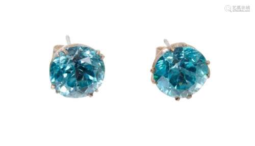 Pair of blue zircon single stone stud earrings, each with a ...