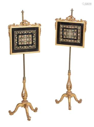 A pair of Victorian giltwood and needlework inset pole scree...