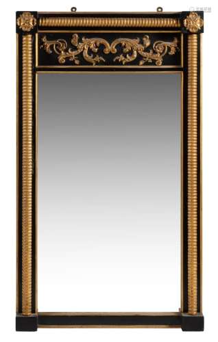 A Regency ebonised and parcel gilt rectangular wall mirror