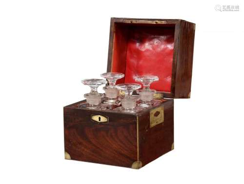 A Victorian mahogany and brass bound campaign four decanter ...
