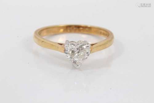 Diamond single stone ring with a heart shaped diamond estima...